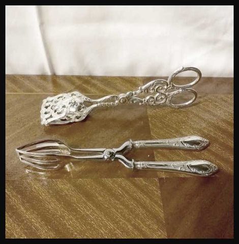 II.2356 TENAZAS DE PLATA